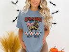 Lion with American flag, "Alpha & Omega" text, and checkered band.