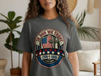 T-shirt with American flag, cross, and "In God We Trust" text.