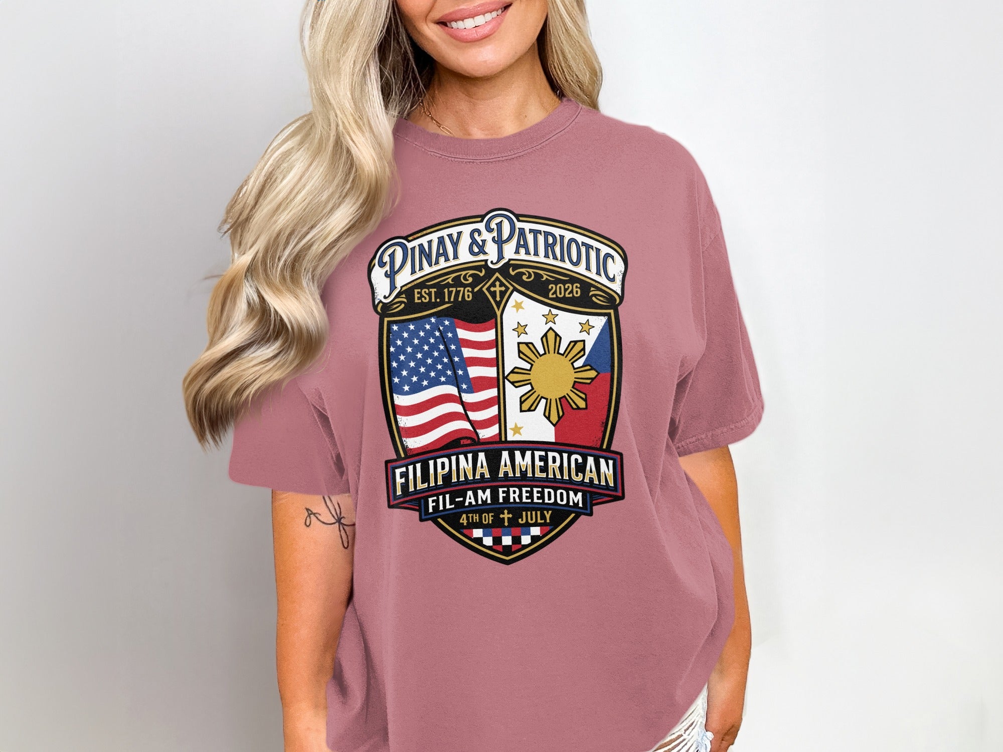 Pink t-shirt with Filipina American flag shield logo and text.