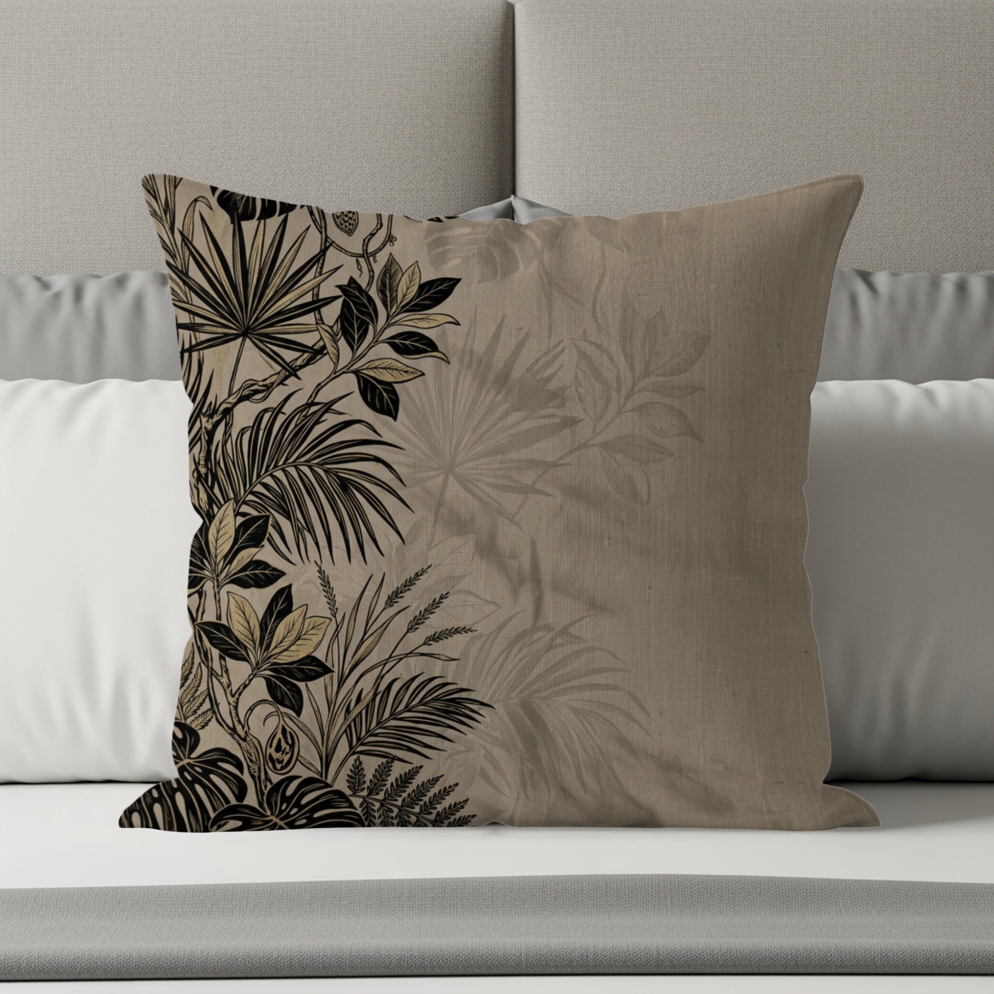 Decorative pillow with a botanical print on a neutral background.