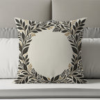 Square throw pillow with ornate gold and black floral wreath design.