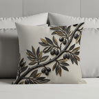 Pillow with a raised gold and dark green olive branch design.