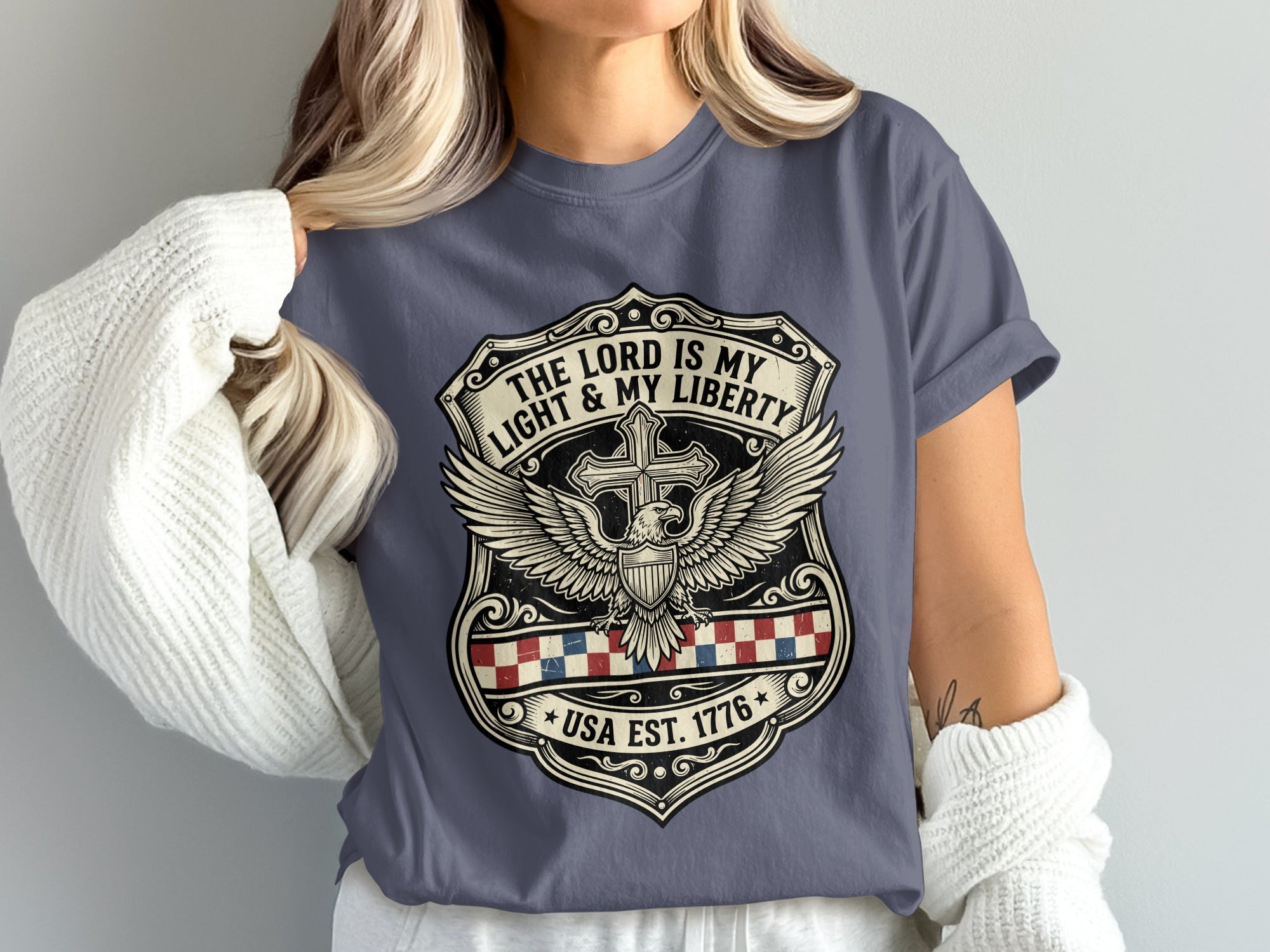 Shield emblem with eagle, cross, and "The Lord is My Light & My Liberty, USA Est. 1776".