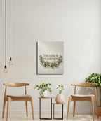 Canvas art with text "The Lord is my Shepherd" hangs between two chairs.
