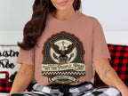 Eagle and shield design with text "We the People... Pray" and Bible verse.