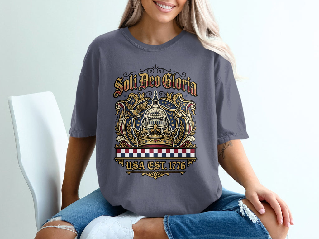 T-shirt with crown, eagle, and "Soli Deo Gloria USA EST. 1776" text.