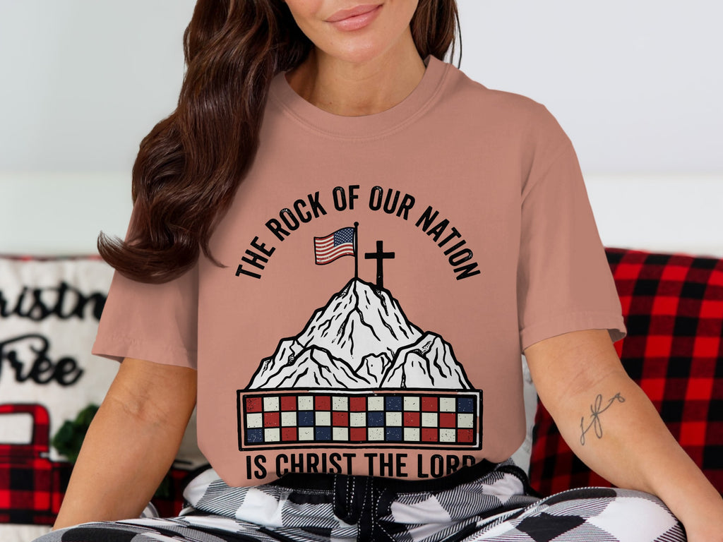 Mountain with American flag and cross, text reads "The Rock of Our Nation Is Christ the Lord."