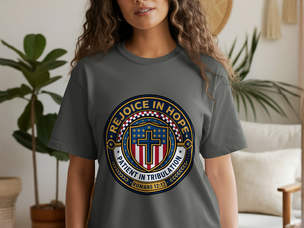 Grey t-shirt with circular graphic featuring stars, stripes, and "Rejoice in Hope Patient in Tribulation."