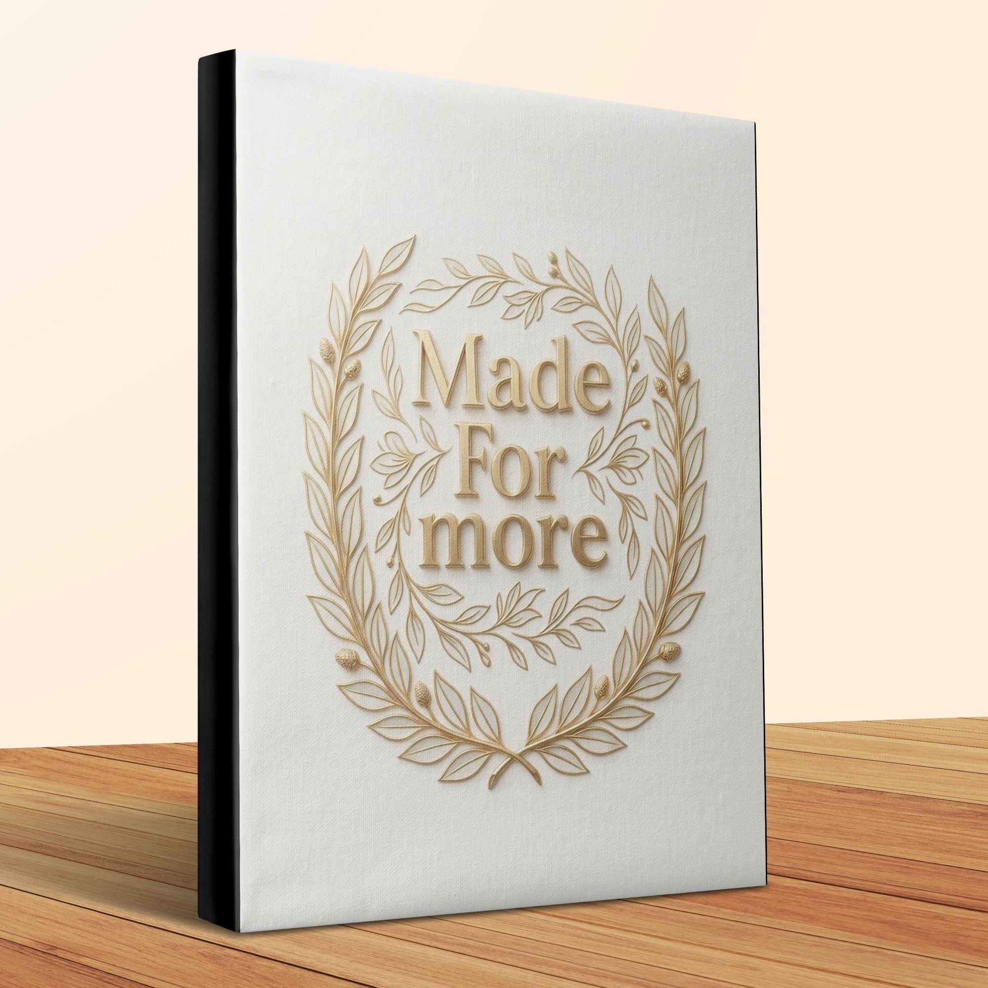 White book with gold "Made For More" laurel wreath emblem.