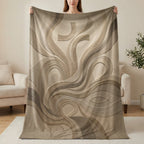 Textured blanket with flowing lines, abstract cross, and small fish symbol.