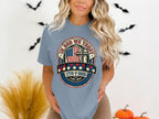 T-shirt with "In God We Trust" text, American flag, and 1776-2026 dates.