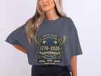 Dark grey t-shirt with "United States Quarterquicentennial 1776-2026" text and eagles.
