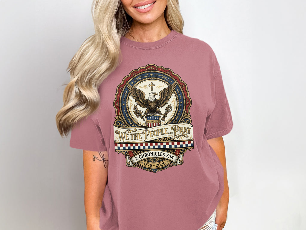 T-shirt with circular graphic featuring eagle, banner, and text: "We the People Pray," "In God We Trust."