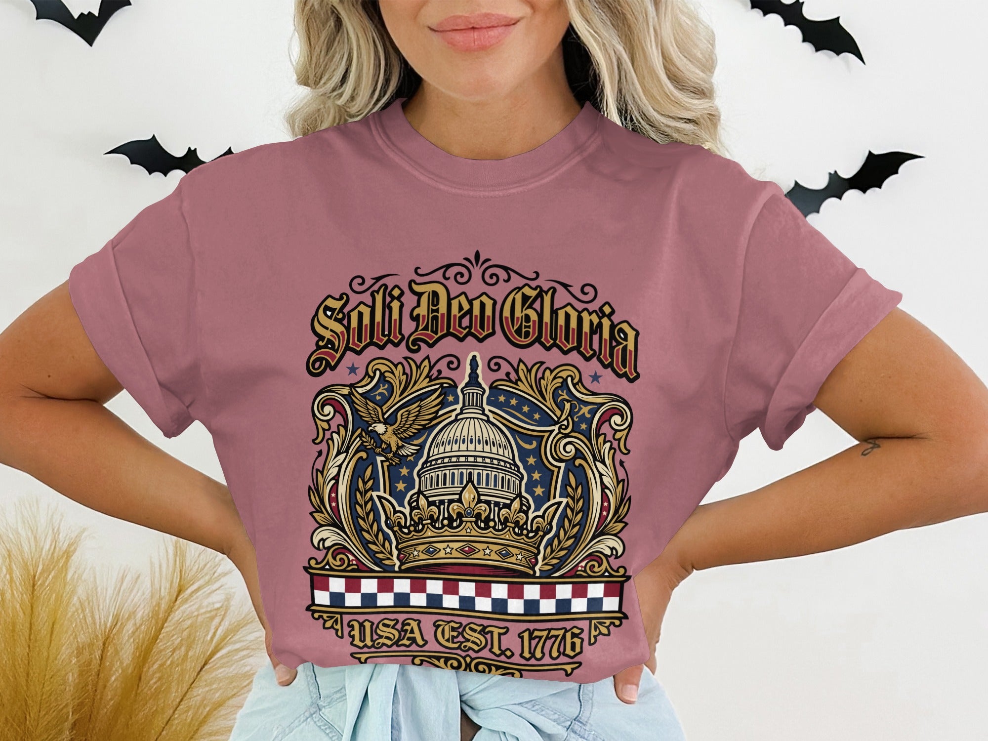 T-shirt with "Soli Deo Gloria" and "USA EST. 1776" text and patriotic eagle design.