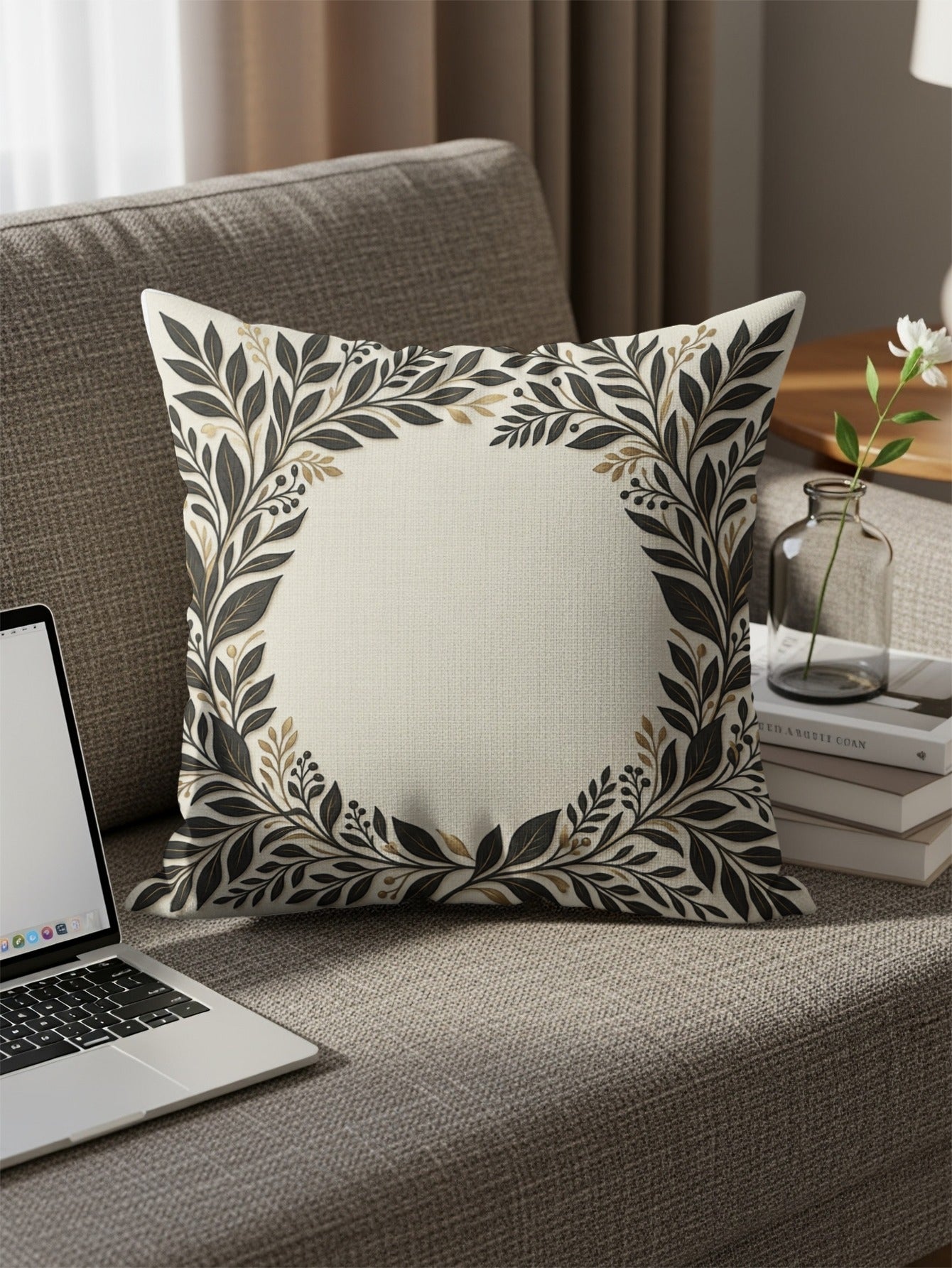 Decorative pillow with a floral wreath design on a couch.