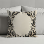 Square linen pillow with black floral border and central empty space.