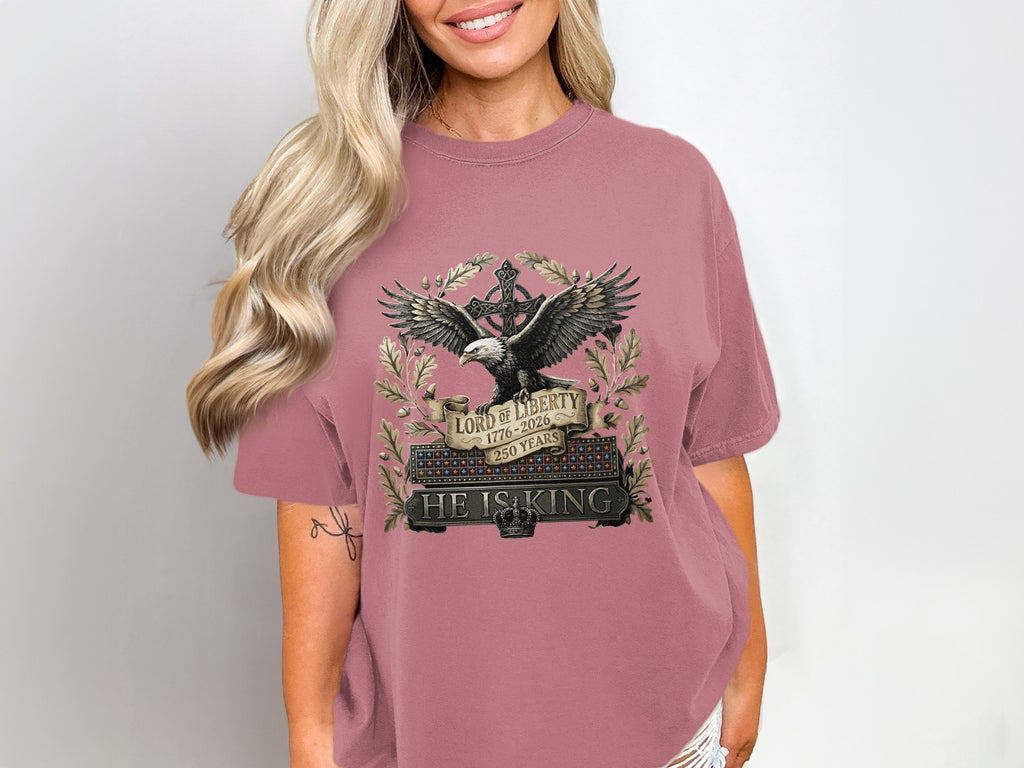 Embroidered eagle with "Lord of Liberty 1776-2026 250 Years" on a pink t-shirt.
