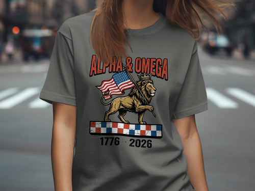T-shirt with lion wearing crown, holding flag, with text "ALPHA & OMEGA 1776 2026".