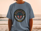 Blue t-shirt with circular emblem featuring "REJOICE IN HOPE" and "PATIENT IN TRIBULATION ROMANS 12:12".