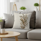 Throw pillow with botanical dried floral print on a sofa.