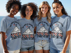 Four smiling young women wear t-shirts with "The Rock of Our Nation is Christ the Lord" design.