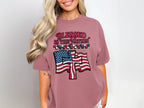 Woman wearing dusty rose t-shirt with "Blessed is the Nation" and US flag graphic.