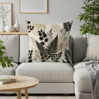 Fitted throw pillow with botanical fern leaf pattern on a cream couch.