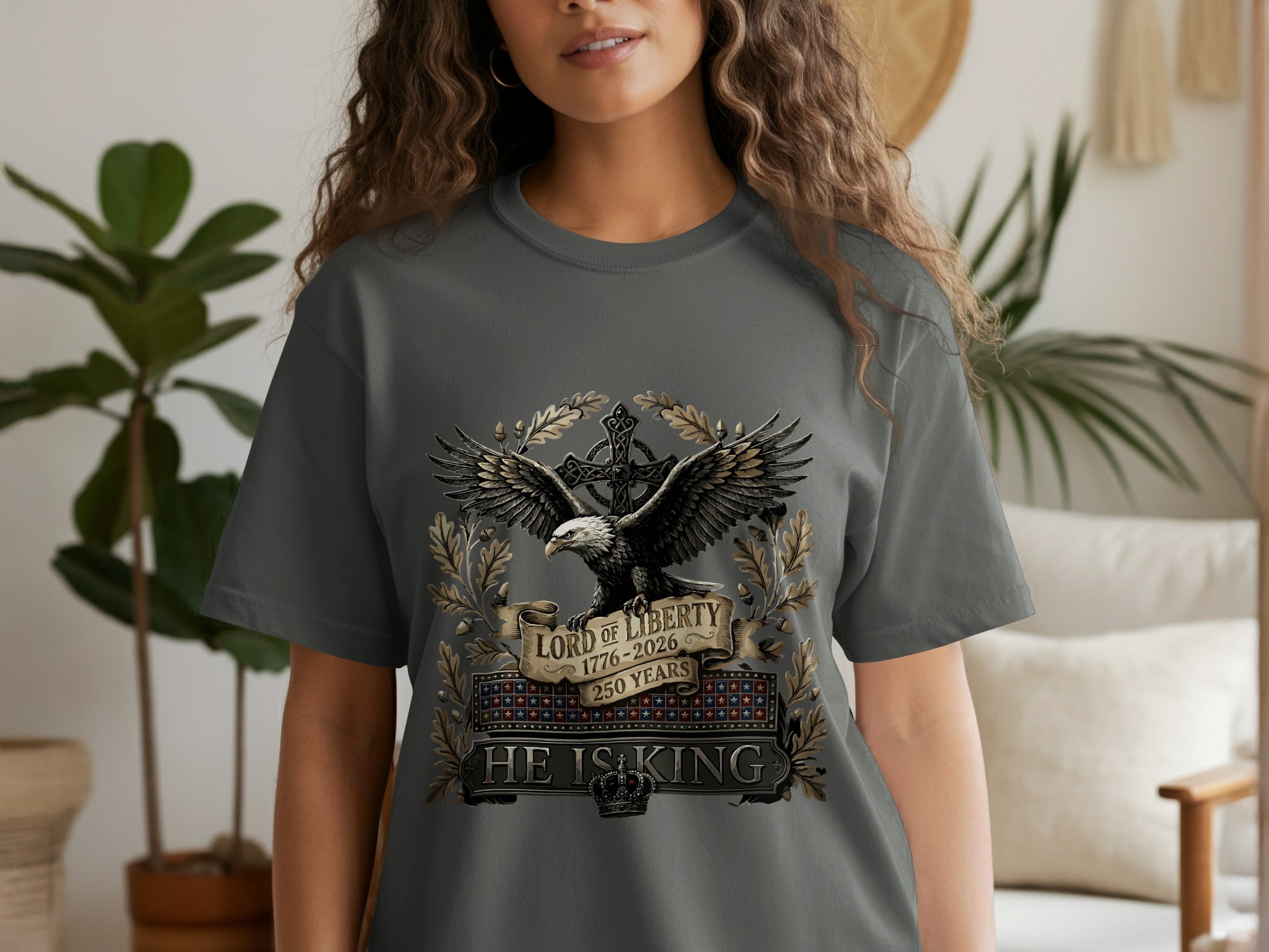Grey t-shirt with eagle, wreath, and "LORD OF LIBERTY 1776-2026 HE IS KING" text.