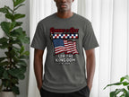Grey t-shirt with American flag and "Running the Race for the Kingdom 1776-2026" text.