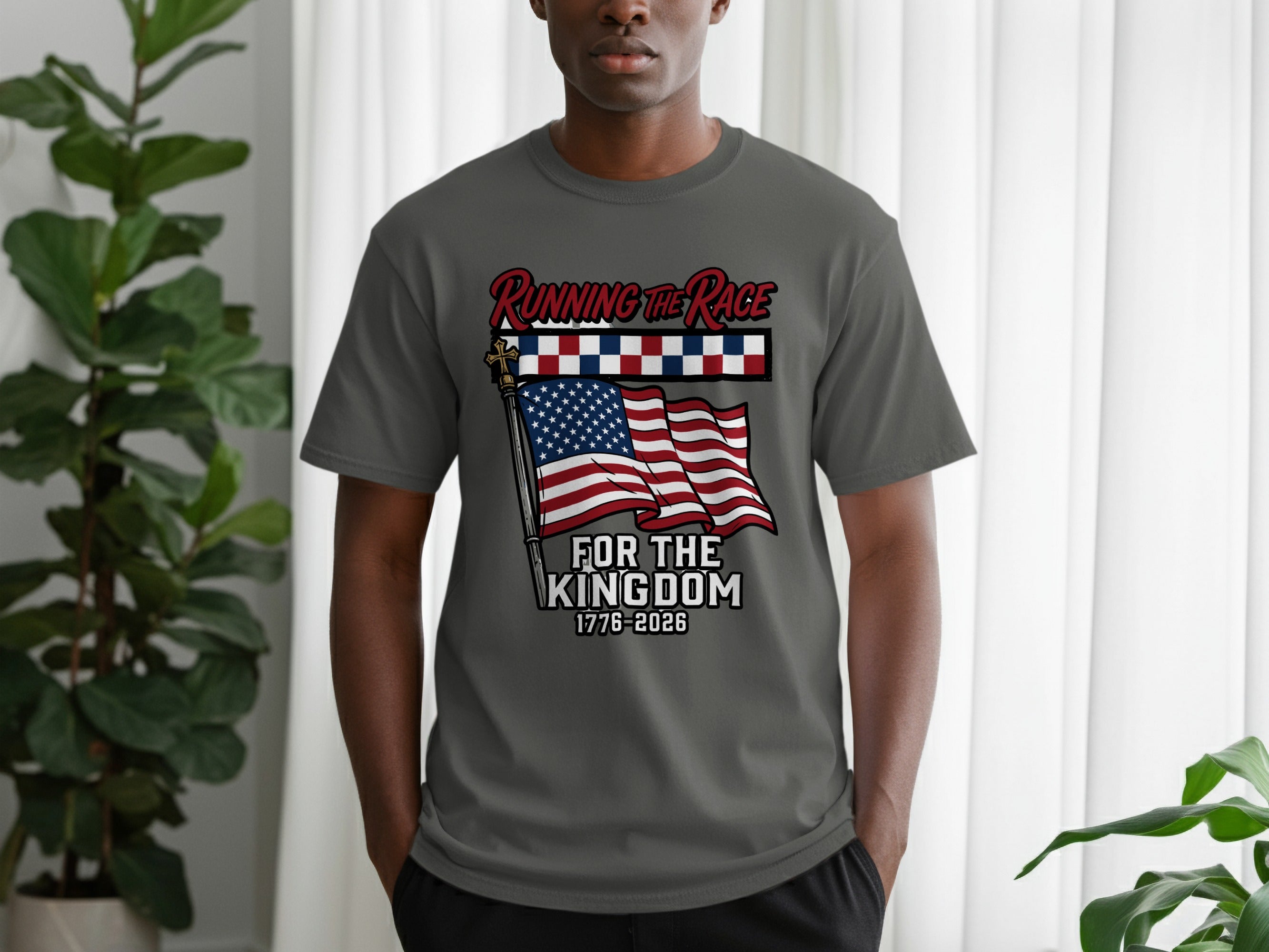 Grey t-shirt with American flag and "Running the Race for the Kingdom 1776-2026" text.