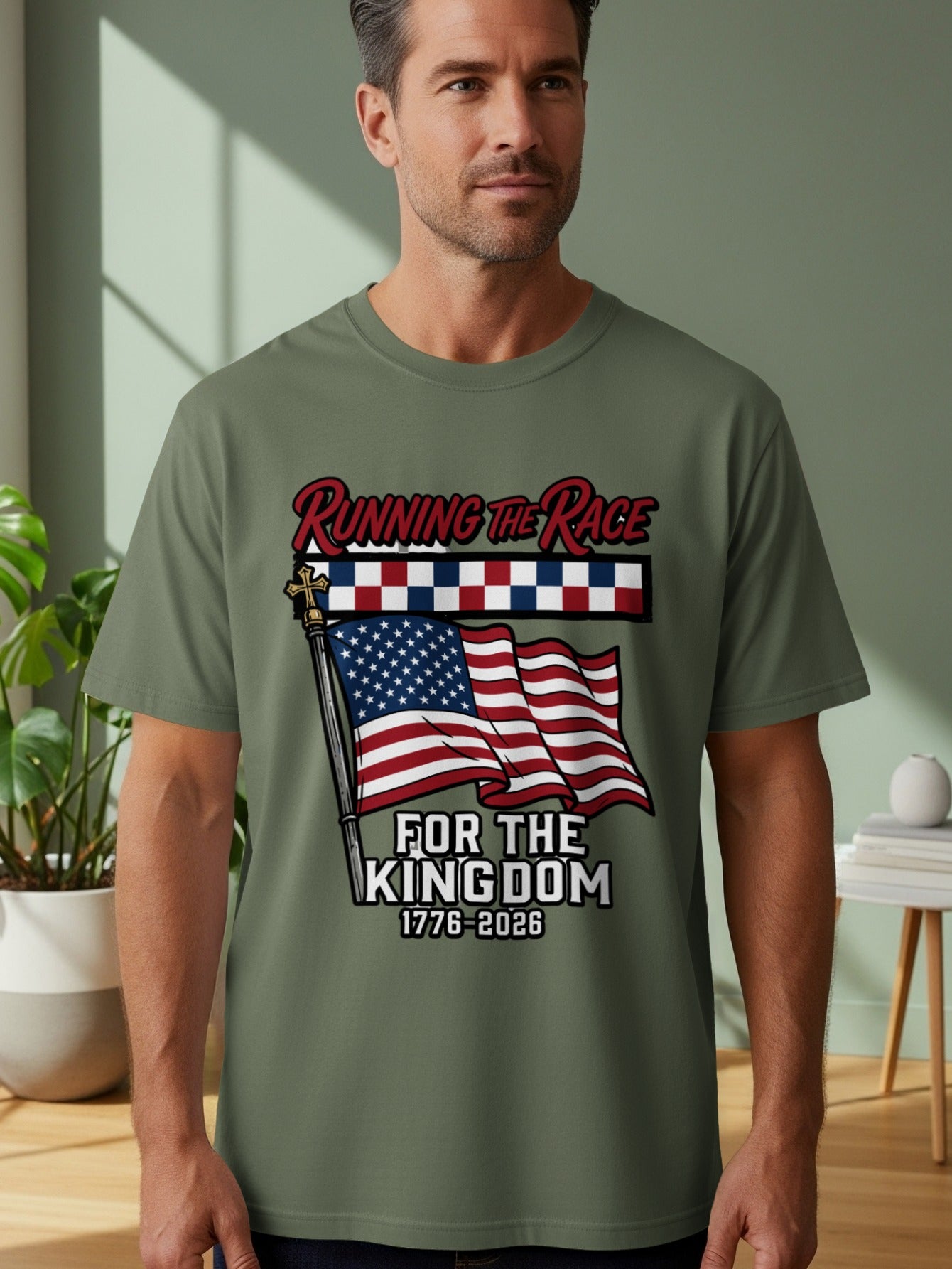 Man wearing olive green t-shirt with American flag and text "Running the Race for the Kingdom 1776-2026".