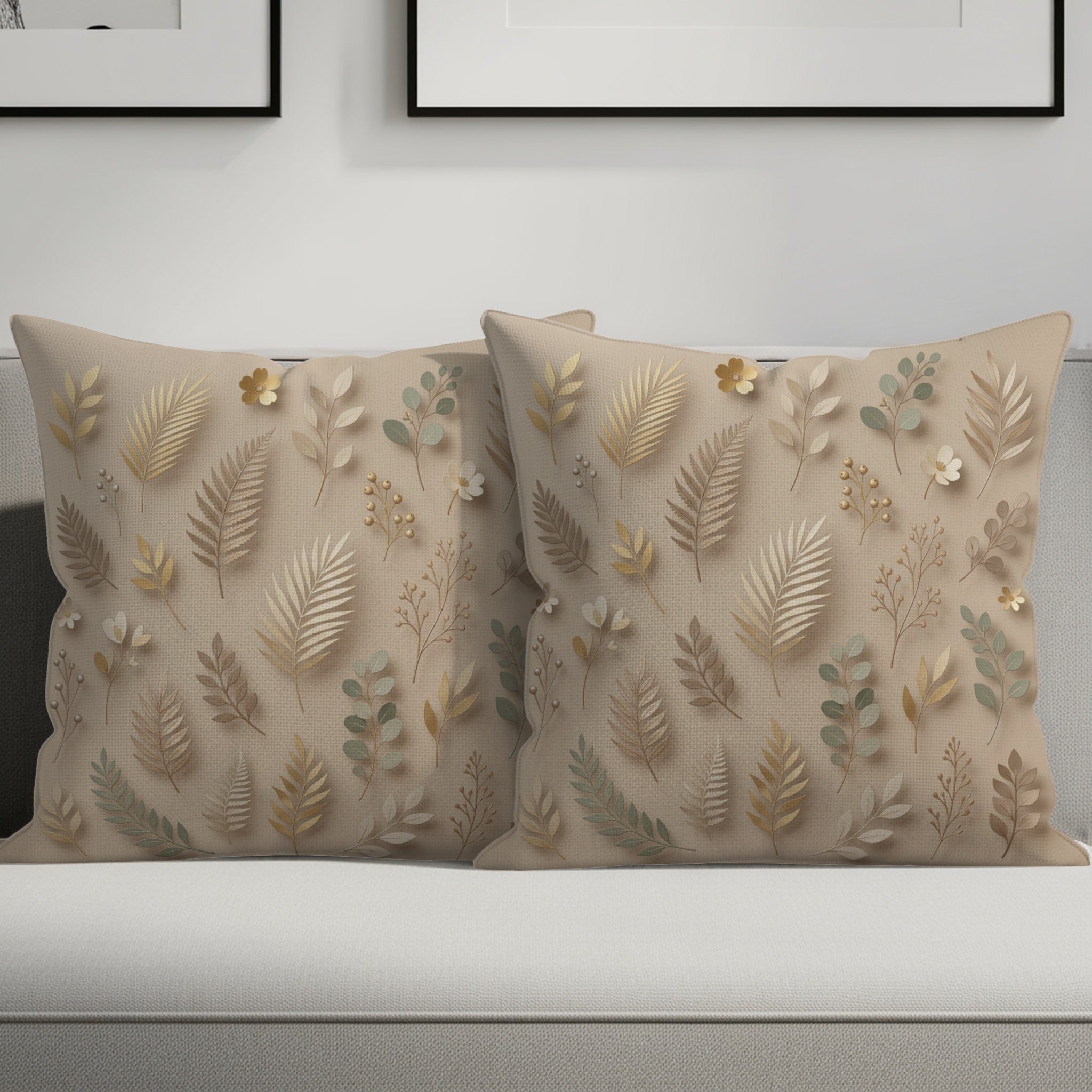 Two neutral-toned throw pillows with a botanical leaf pattern.