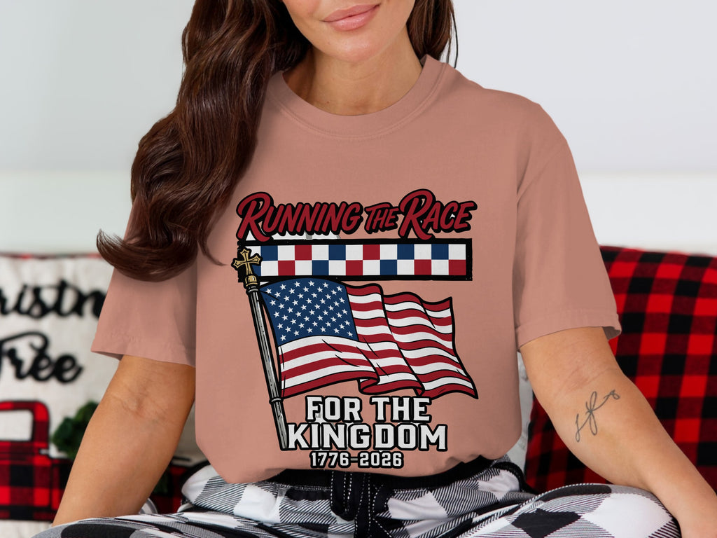 Woman wearing a shirt with an American flag and "Running the Race For the Kingdom 1776-2026".
