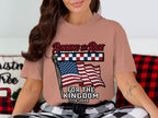 Woman wearing a shirt with an American flag and "Running the Race For the Kingdom 1776-2026".