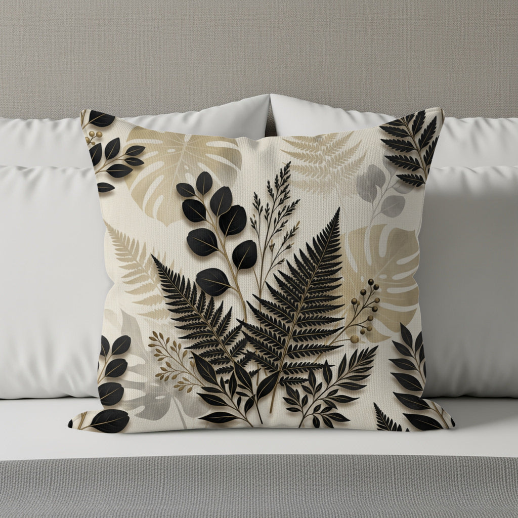 Beige pillow with a detailed black and beige botanical leaf pattern.