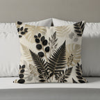 Beige pillow with a detailed black and beige botanical leaf pattern.