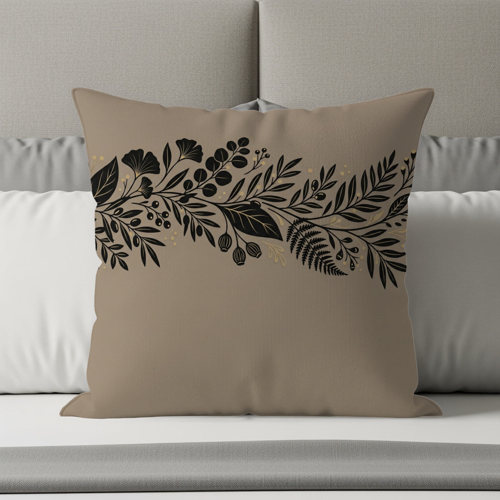 Tan throw pillow with a black and gold botanical floral border design.