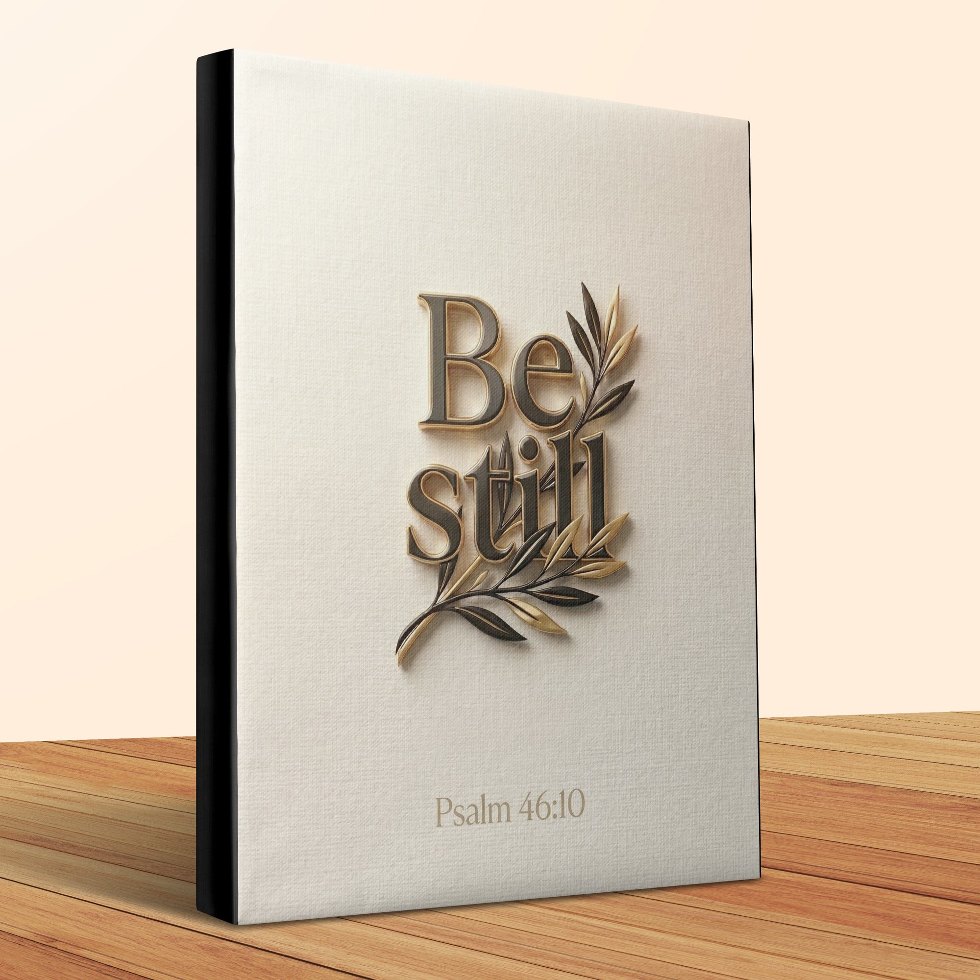Be Still Psalm 46:10 devotional book with embossed gold lettering and olive branches.