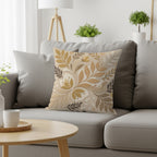 Cushion with floral pattern on a gray sofa next to a coffee table.