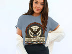 Blue t-shirt with eagle emblem and "We The People... Pray" text.