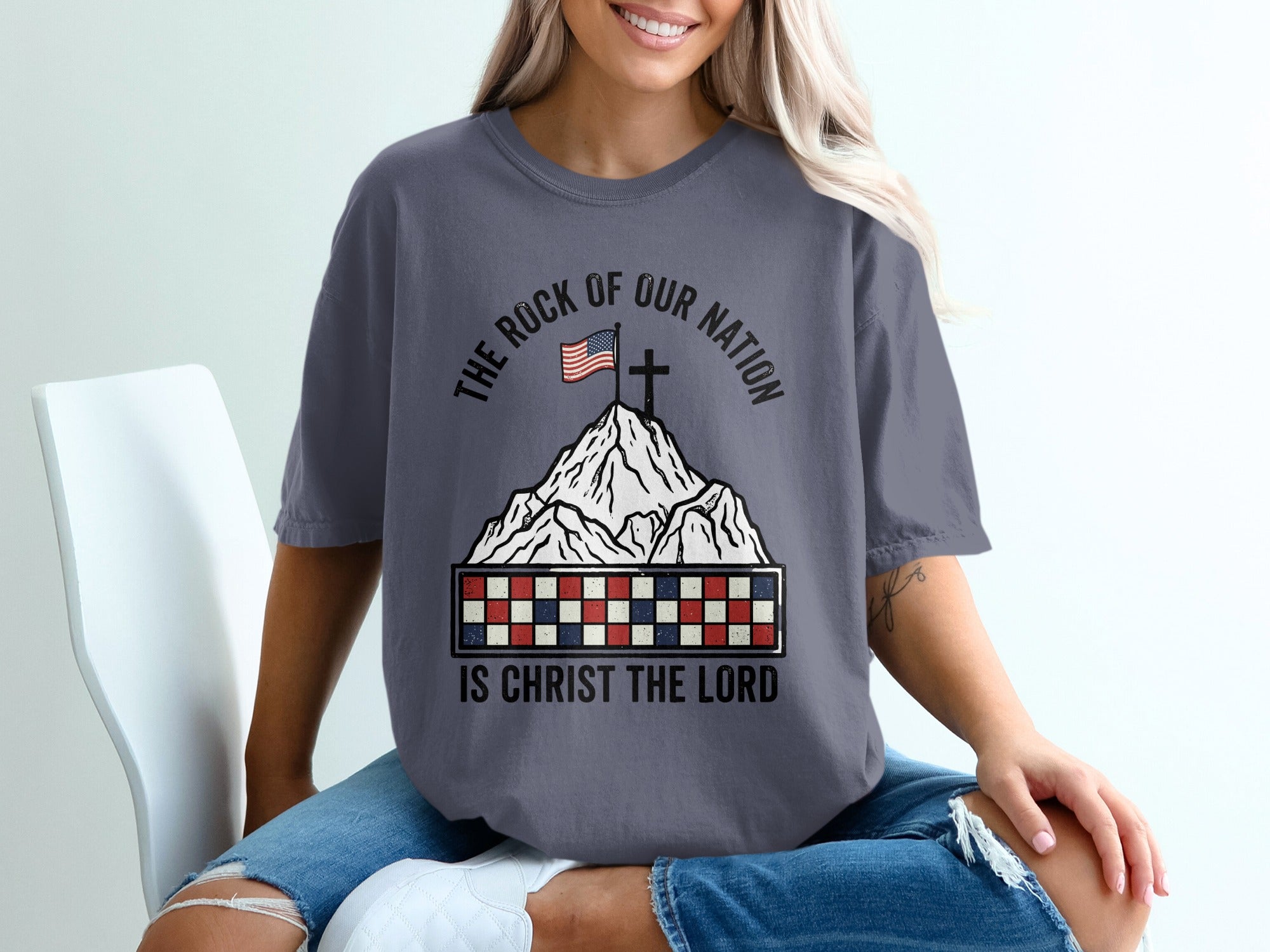 T-shirt with mountains, cross, and "The Rock of Our Nation Is Christ the Lord".