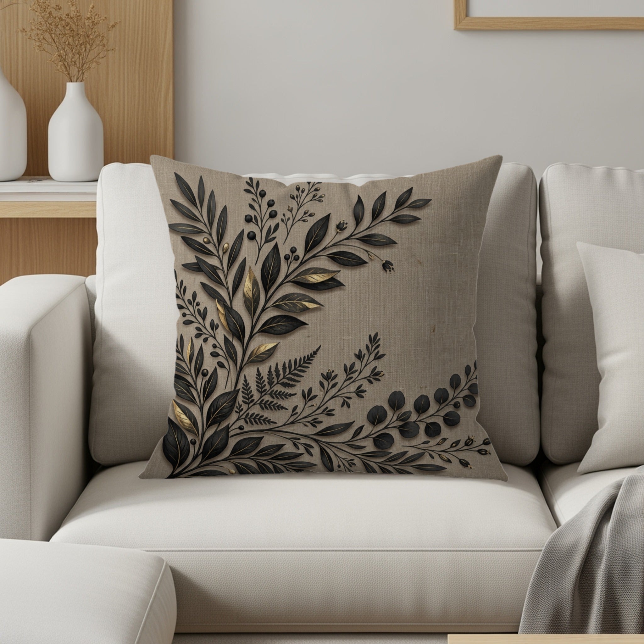 Cushion with dark botanical print on a light textured background.