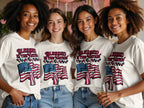 Four women wearing t-shirts with American flags and "Blessed is the Nation" text.