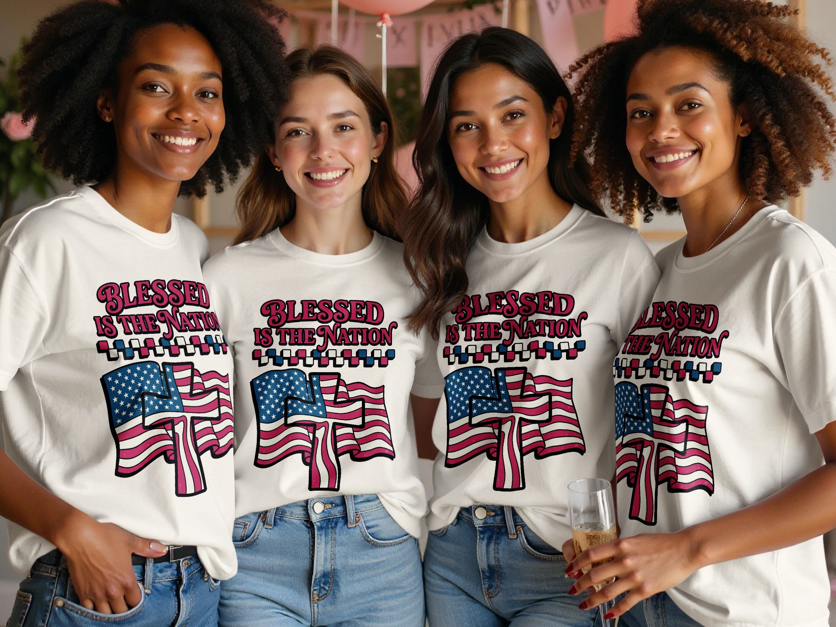 Four women wearing t-shirts with American flags and "Blessed is the Nation" text.