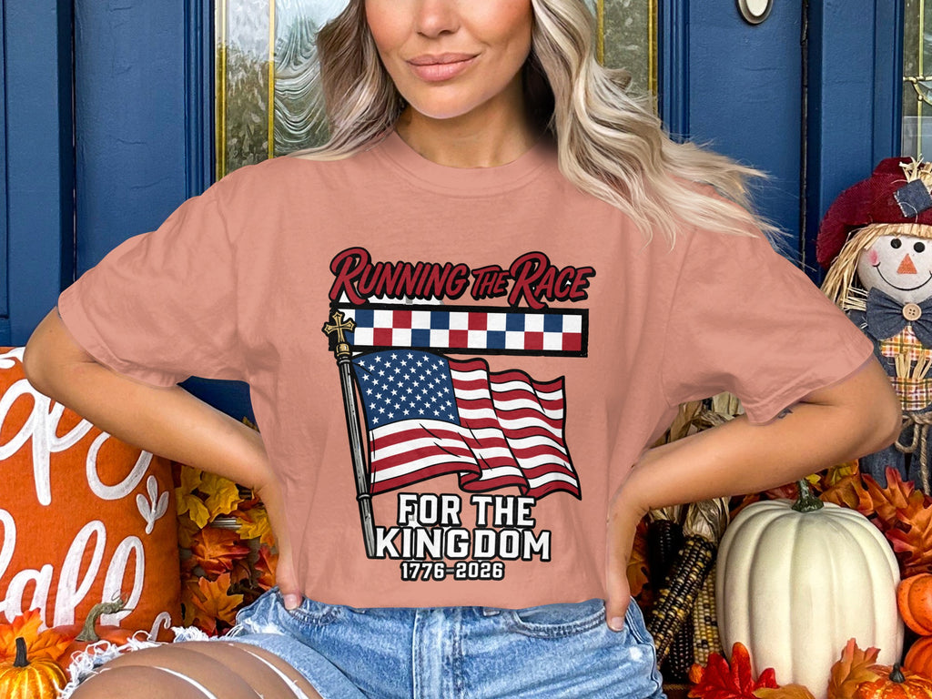 Peach t-shirt with American flag and text "Running the Race For the Kingdom 1776-2026".