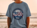 Gray t-shirt with "250" and "United States of America Semiquincentennial Est. 1776" graphic.
