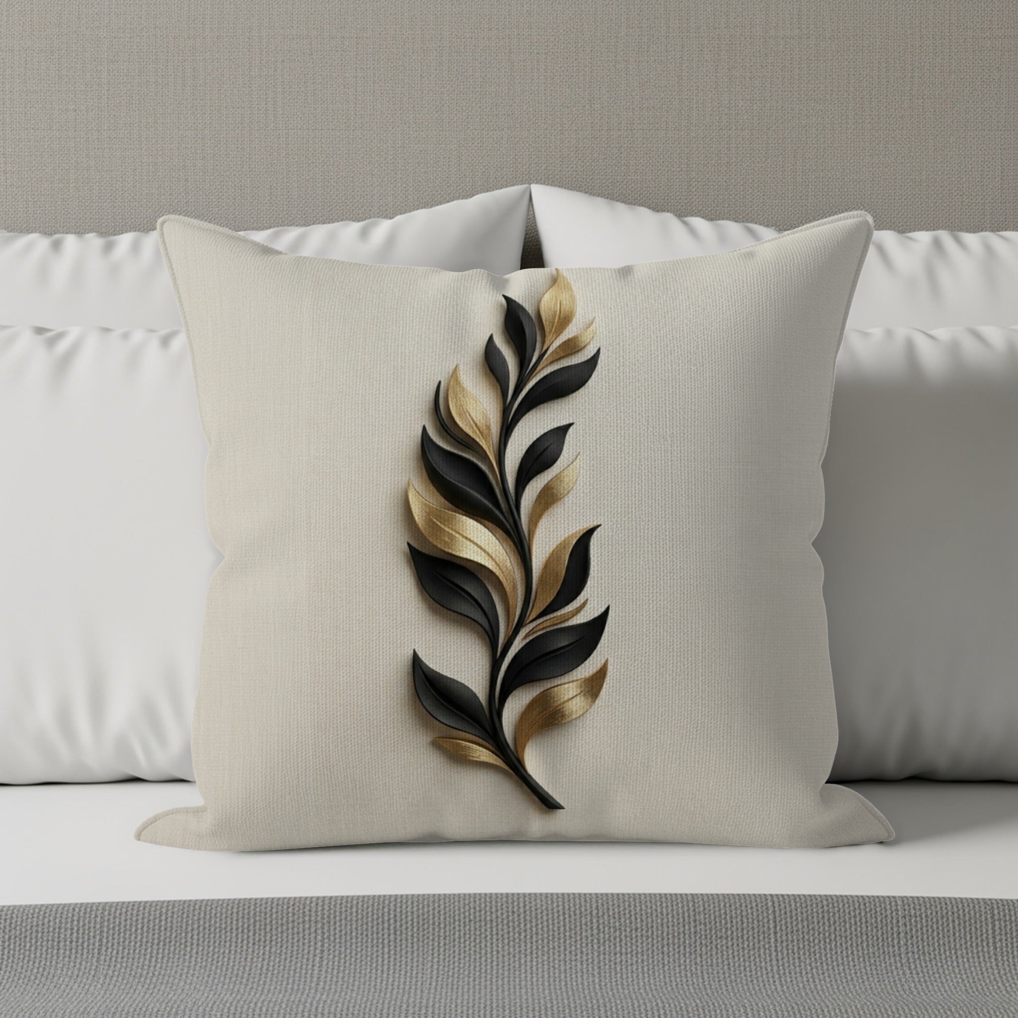 Decorative pillow with a black and gold leaf design on a textured background.