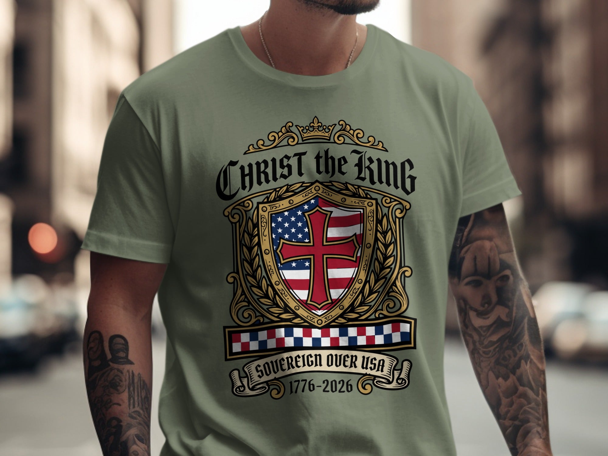 Olive green t-shirt with Christ the King sovereign over USA crest and dates.