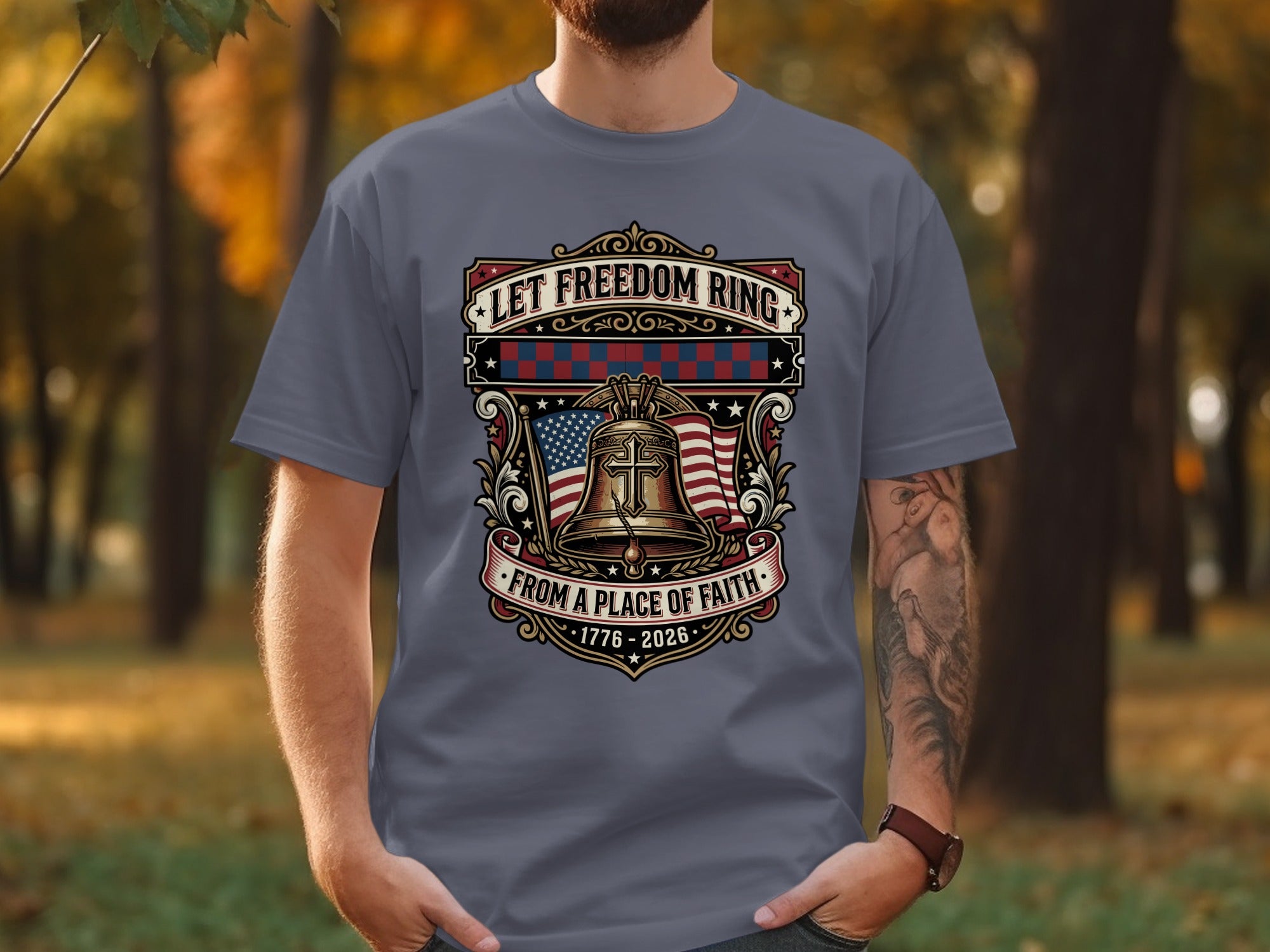 T-shirt with bell, US flag, and text "Let Freedom Ring from a Place of Faith 1776-2026".