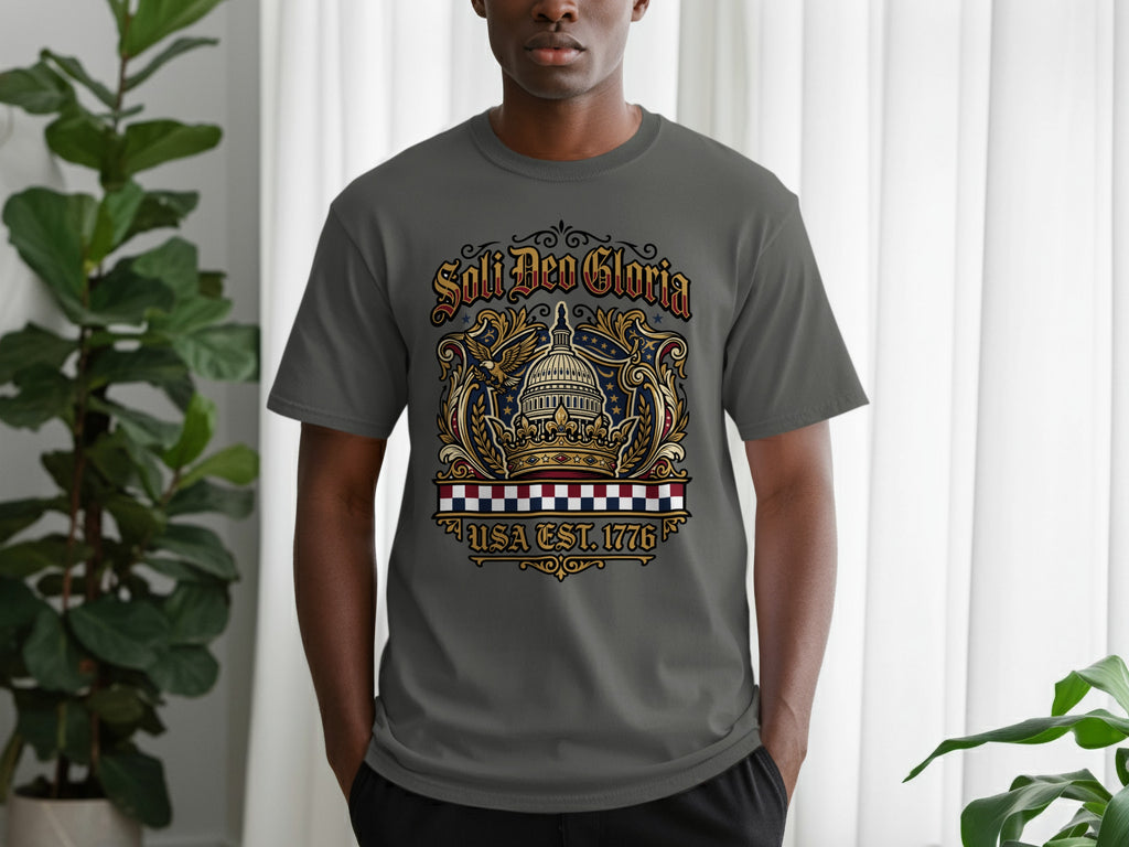 Gray t-shirt with "Soli Deo Gloria USA Est. 1776" text and patriotic eagle design.